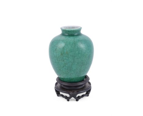 A Chinese green-glazed vase, Qing Dynasty, Kangxi, covered overall with a fine network of crackles beneath the green glaze be