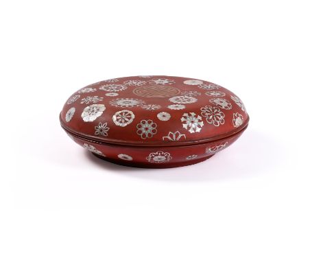 Y A Chinese mother-of-pearl inlaid lacquered box and cover, Qing dynasty, the circular domed lid with a central gilt shou cha