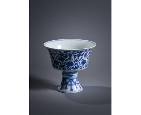 A Chinese blue and white stem cup, Qianlong seal mark and of the period, supported on a splayed hollow stem foot angled to th