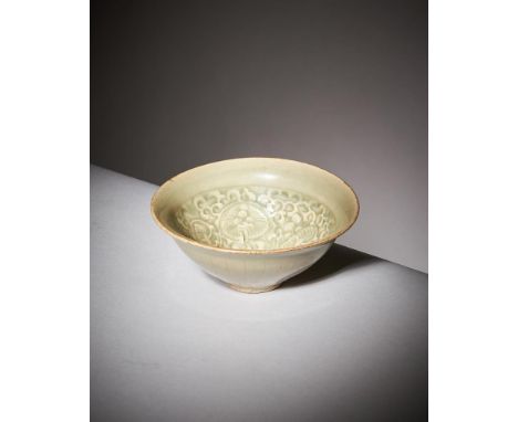 A small Chinese 'Yaozhou' celadon glazed 'chrysanthemum' bowl, Northern Song or Jin Dynasty, 12-13th century, of conical form