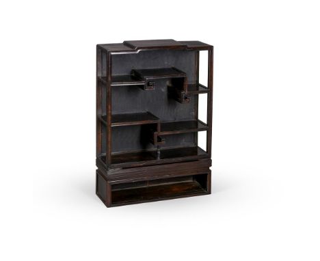 A Chinese zitan and hardwood kang display cabinet, 18th or 19th century, constructed with stepped shelves of varying heights 