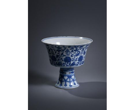 A Chinese blue and white 'lanca' stem cup, Qianlong seal mark and of the period, supported on a splayed hollow stem foot with