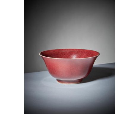 A Chinese copper-red bowl, Kangxi, on short foot with flared rim, with crushed strawberry veined glaze, flared rim, the base 