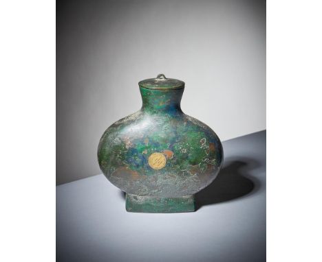 A Chinese bronze ritual wine flask and cover, Bianhu, Han Dynasty, of flattened oval form with attractive green patination, t