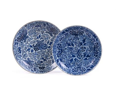 Two Chinese blue and white 'peony' chargers, Kangxi, the larger with Lingzhi fungus mark within double circle to base, approx
