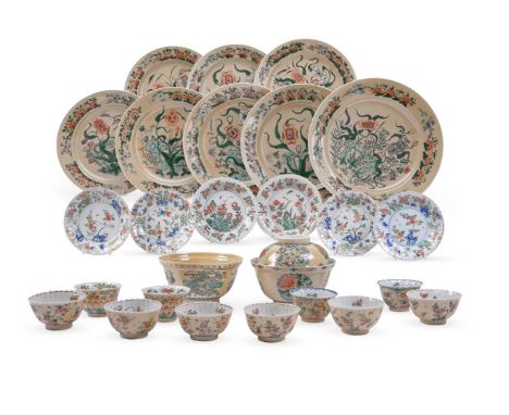 A rare group of Chinese cafe-au-lait 'Famille-Verte' wares, Kangxi, comprising: eight plates painted with flowers and foliage