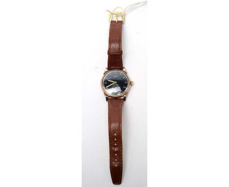A 1950s Trebex yellow-metal cased wristwatch, with manual-wind non-magnetic movement, black dial, Arabic numerals, and subsid