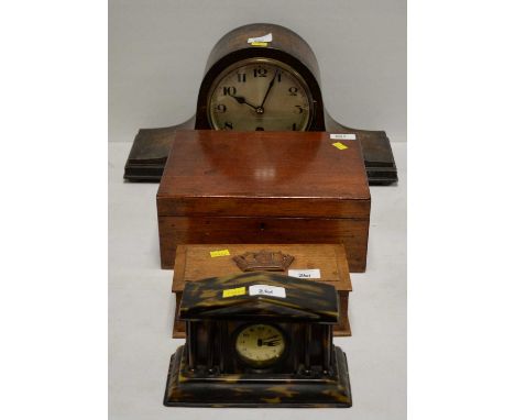 An early 20th Century domed case mantel clock, the stained oak frame 23cms high; together with two stained wooden boxes; and 