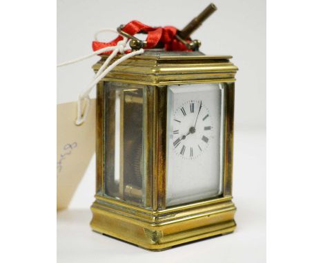 A 19th Century French brass-cased miniature carriage clock, approximately 10cms high overall (including handle), with key.