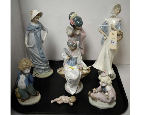 Two Lladro figures of ladies, each modelled as a Geisha, the taller approximately 29cms high; together with five Nao figures,