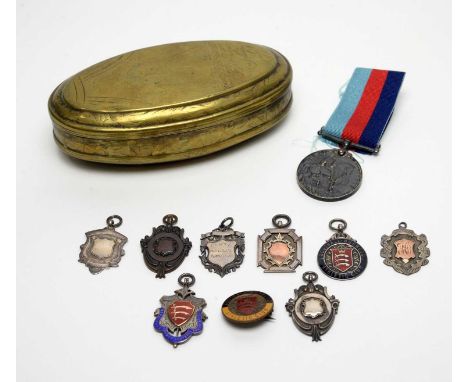 A collection of silver and other sporting fob medals, a Great War medal to 81066 GNR R J Moores R.A, and a 19th Century brass