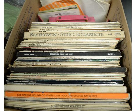 A selection of vinyl LPs, artists including: Buddy Holly, Sonny &amp; Cher, and others, one box. 