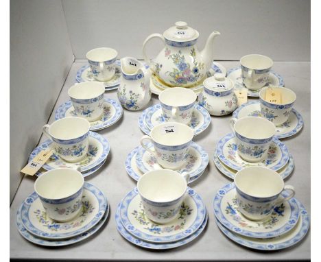 A Royal Doulton 'Coniston' tea service, comprising: nine tea trios, lidded sugar bowl, cream jug, teapot, sandwich plate and 