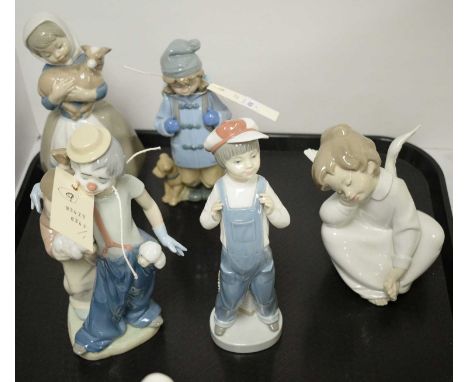 A selection of three Lladro figures, including: a figure group of a girl and clown with puppy, approximately 22cms high; an a