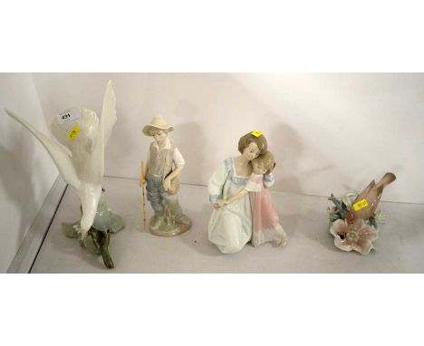 Four Lladro figures, including: a turtle dove; a bird; a fisherboy; and a figure group of a mother and child.