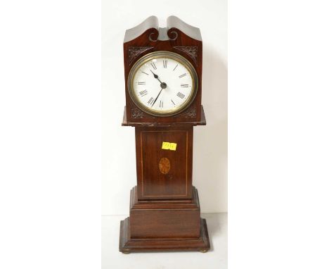 An early 20th Century mahogany miniature longcase clock, the case with carved and inlaid decoration, approximately 38cms high