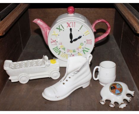 An assorted lot of mid 20th century household ceramics, to include clock in the form of a teapot, ceramic coach, boot, mini b