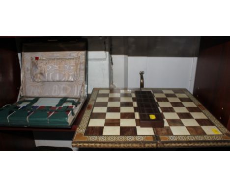 A vintage cased four card set bridge compendium with fitted and lined interior, a wooden games board and cribbage holder