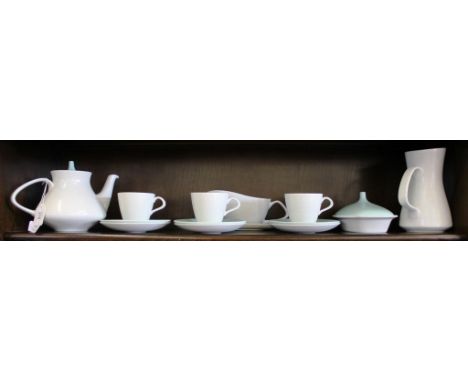 A collection of vintage Poole Pottery tableware in twin tone ice green / mushroom, to include three cups, six saucers, tea po