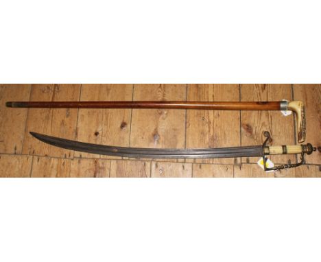 A 19th century cavalry sword with simulated ivory handle, 84cm long and a carved bone-handled walking stick