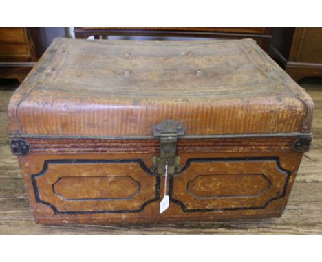 An early 20th century oblong metal travelling trunk with brass fittings, 56cm x 46cm