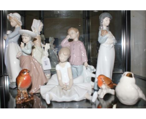 A selection of six Nao ceramic figurines of boys and girls, two Goebel ceramic figurines of birds, one Beswick robin, (9)