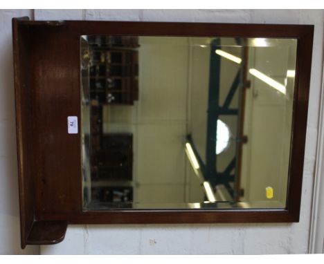 An Edwardian mahogany framed wall mirror with bevel edged glass plate with shelf under, 62cm x 47cm