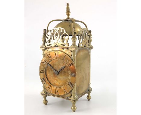 A 17th century style brass lantern clock timepiece, with French carriage movement, 25cm high