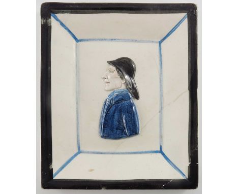 A pearlware relief moulded portrait plaque of a sailor, modelled in profile, within integral frame, 20.5cm x 17.5cm