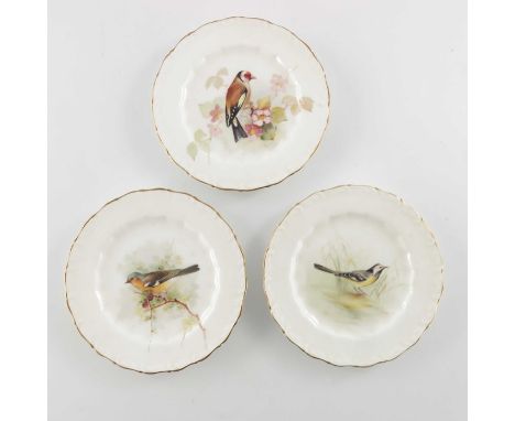 W Powell for Royal Worcester, three small bird painted plates, 1917, decorated and titled Gold Finch, Chaffinch and Wagtail, 