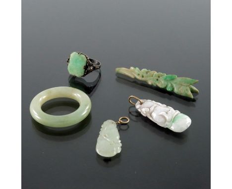 Three Chinese carved jade pendants, together with a silver and marcasite jade ring and a carved ring, two pendants in the for