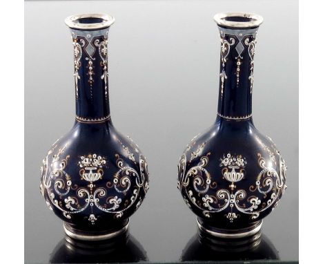 A pair of French silver and enamelled miniature vases, circa 1880, globe and shaft form, blue ground with raised white and gi