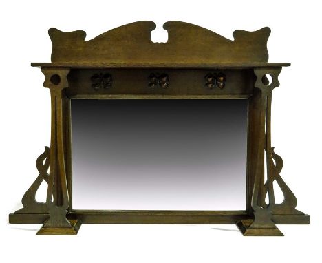 An Arts and Crafts oak and copper overmantle mirror, the rectangular bevelled glass below three repousse embossed butterflies