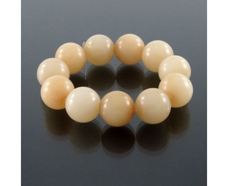 A set of Chinese carved jade beads, uniform spherical form, eleven beads approx 2cm diameter (11)