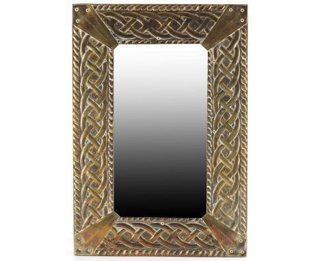 An Arts and Crafts brass mirror, in the Glasgow style, Celtic knot within ropetwist borders, bevelled glass, 44cm x 30cm