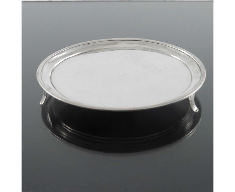 A George II silver waiter or small salver, Thomas Nash I, London 1759, plain circular form, banded border, on three fluted br