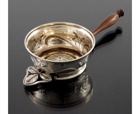 A French Art Nouveau silver and gilt tea strainer, Charles Forgelot, Paris circa 1905, the circular ogee body embossed and ch