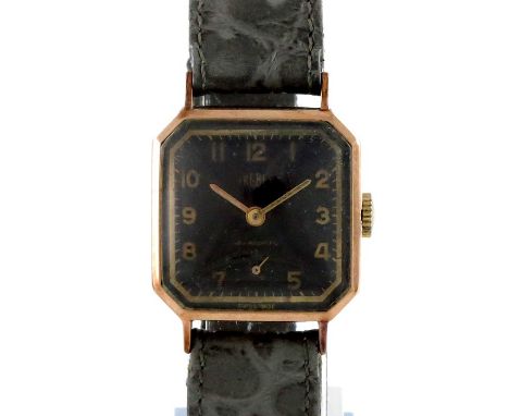 Trebex, a 9 carat gold wrist watch, square with chamfered corners, black dial and arabic numerals with subsidiary seconds dia