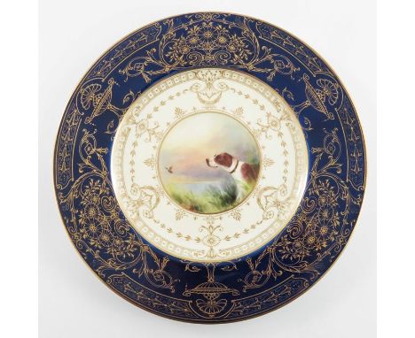 A Royal Worcester painted cabinet plate, 1934, the central roundel decorated with a hunting dog and mallard in highland lands