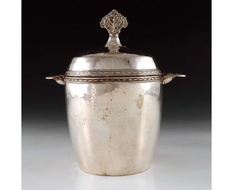 Edward Spencer for the Artificers Guild, an Arts and Crafts silver plated tea caddy, circa 1915, planished, twin handled barr