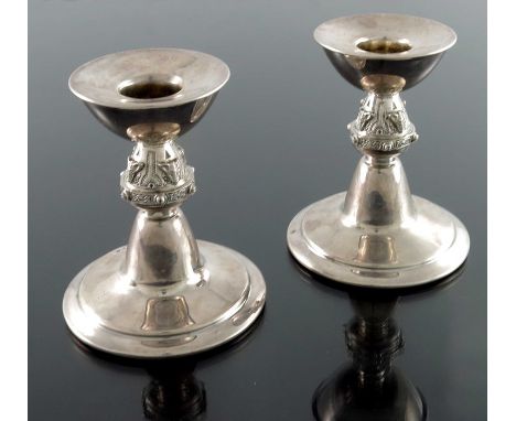 A pair of Iona style silver candlesticks, Hardy Brothers, Birmingham 1965, the stepped conical bases with Celtic knot and zoo