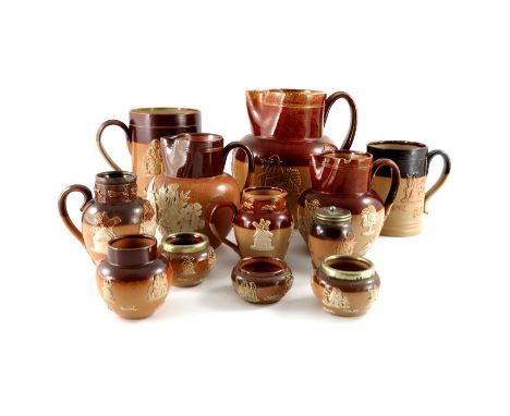 A collection of Royal Doulton and Lambeth stoneware sprigged ware, including hunting jugs and mugs, salt cellars etc., 16.5cm