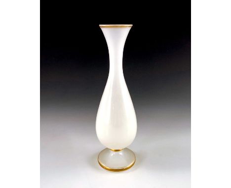 Baccarat (attributed), a French white opaline glass vase, 19th century, footed elongated baluster form, with gild bands, snow