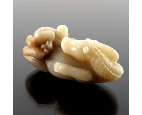 A Chinese jade carving, in the form of a supine horse with monkey, 9cm 