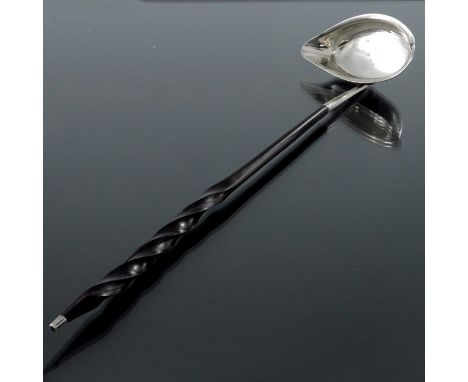 A George III silver and horn ladle, Josiah Snatt, London 1807, the boat shaped bowl with single lip, 36cm long