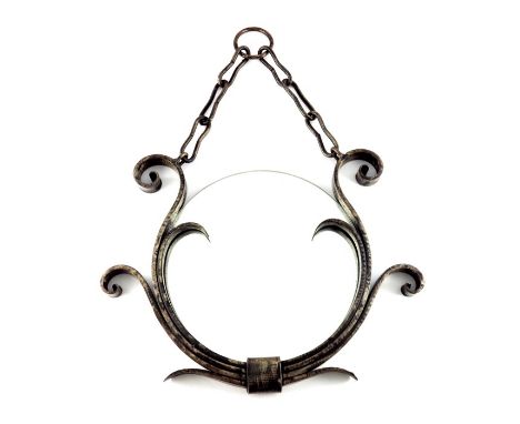 Raymond Subes (attributed), an Art Deco wrought iron mirror, circa 1920s, the circular glass within a four strap scrolled fra