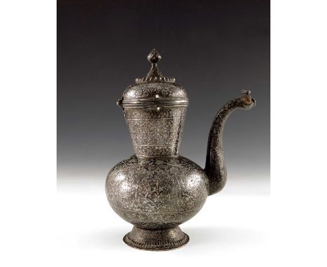 An 18th century or earlier Indian Mughal silver and niello enamel ewer or chuski, bulbous form with conical neck and domed li