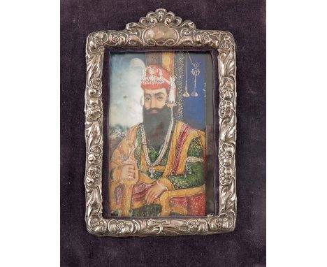 λ Indian School (19th century), A Portrait of a Sikh Maharaja on ivory, possibly Ranjit Singh, 14cm x 8.5cm, silver mount and