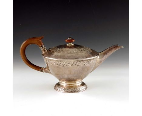 Bernard Cuzner for Liberty and Co., an Arts and Crafts silver teapot, William Hair Haseler, Birmingham 1913, model 5859, pede