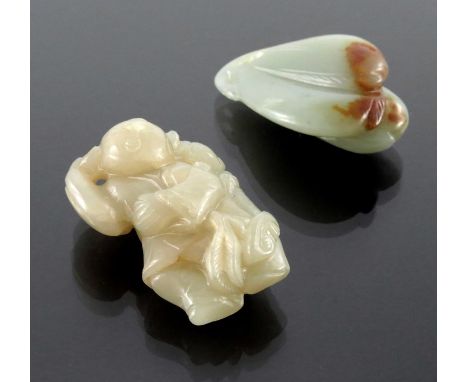 Two Chinese carved jade pendants, one as a group of peaches, the other of a man and boy with ruyi sceptre, 5cm (2)